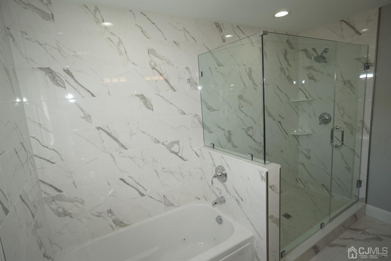 69 Albemarle Road Colonia, NJ 07067 - Photo 22 of 40 a bathroom with a bathtub and shower