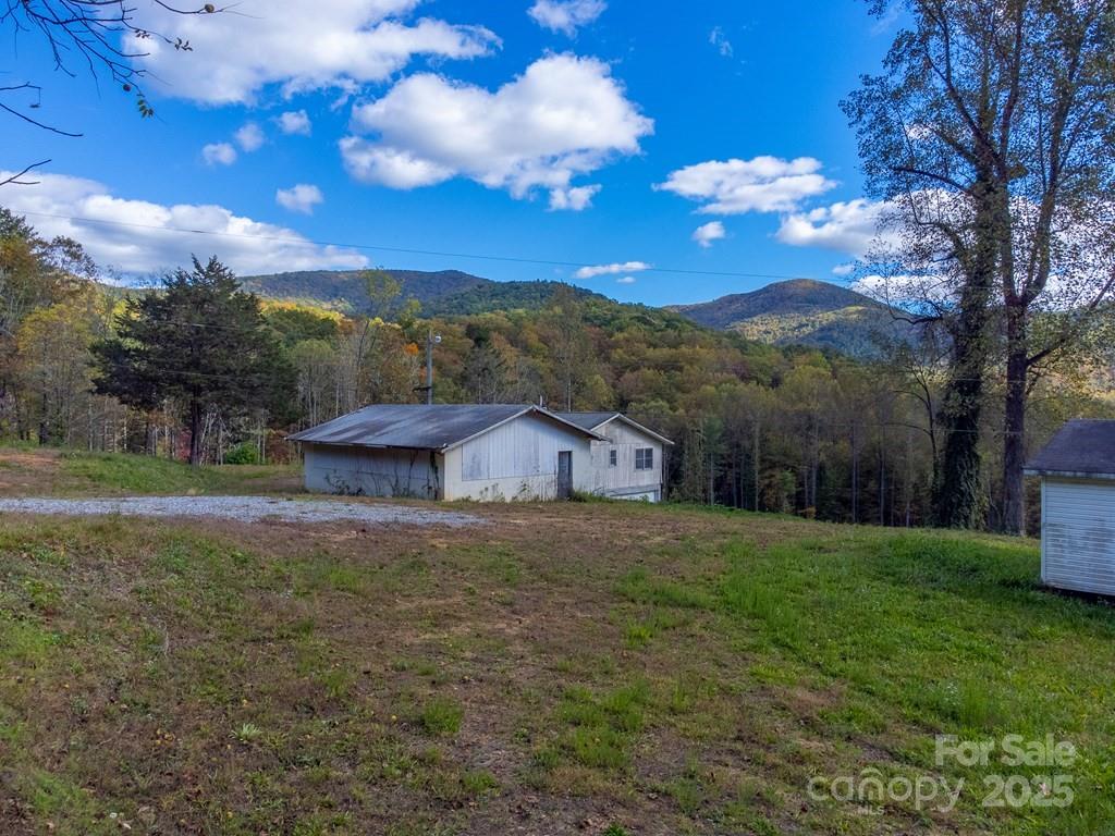 8125 Ellijay Road Franklin, NC 28734 - Photo 6 of 35 a view of a big yard with an trees
