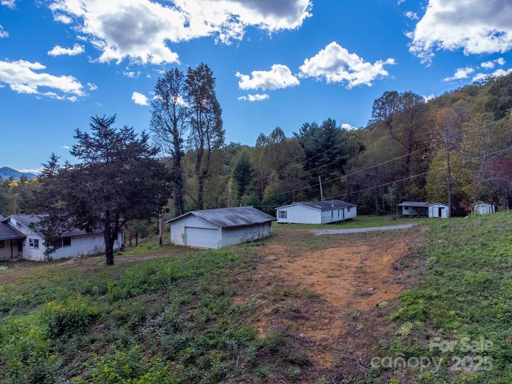 8125 Ellijay Road Franklin, NC 28734 - Photo 9 of 35 a view of a backyard with sunset