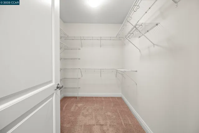 a bathroom with a tub sink shower and mirror