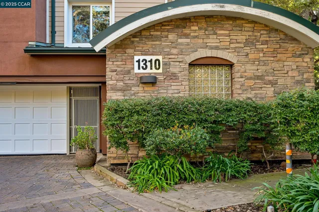 a living room with furniture a fireplace and a table