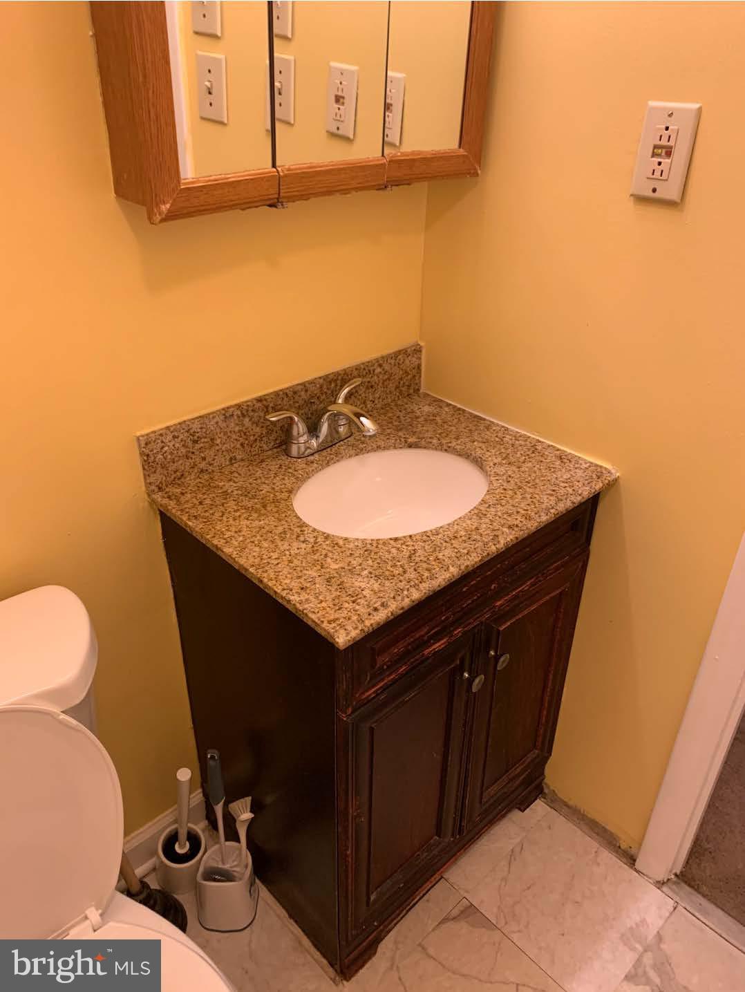4330 Hartwick Road, Unit 211 College Park, MD 20740 - Photo 12 of 13 Charming bathroom with elegant fixtures.
