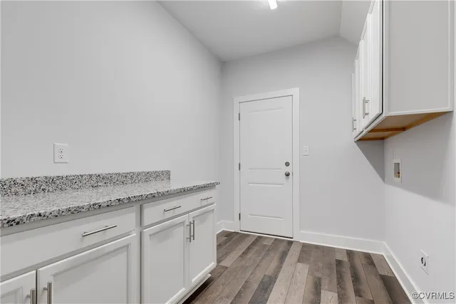 a view of a storage and utility room with closet
