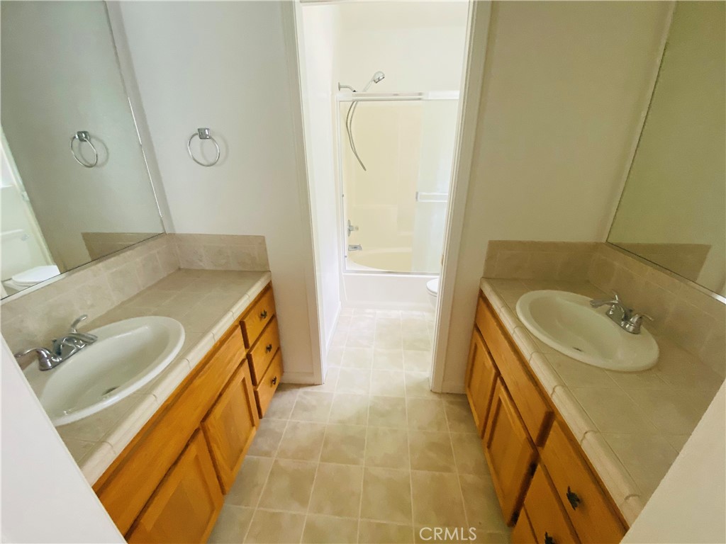 16506 Ridgecrest Court Hidden Valley Lake, CA 95467 - Photo 12 of 25 a bathroom with a sink and mirror