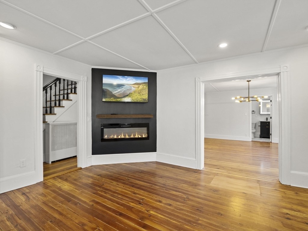 224 Pelham Street Methuen, MA 01844 - Photo 13 of 40 a view of empty room with kitchen and window