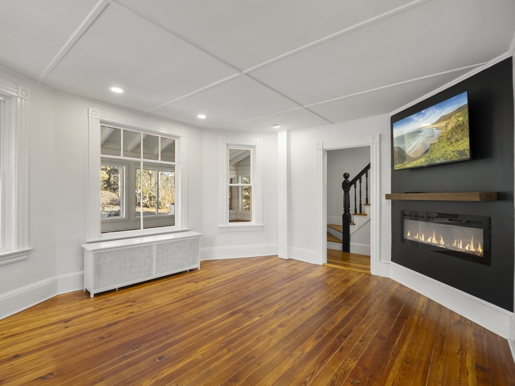 224 Pelham Street Methuen, MA 01844 - Photo 14 of 40 a view of an empty room with window and fire place