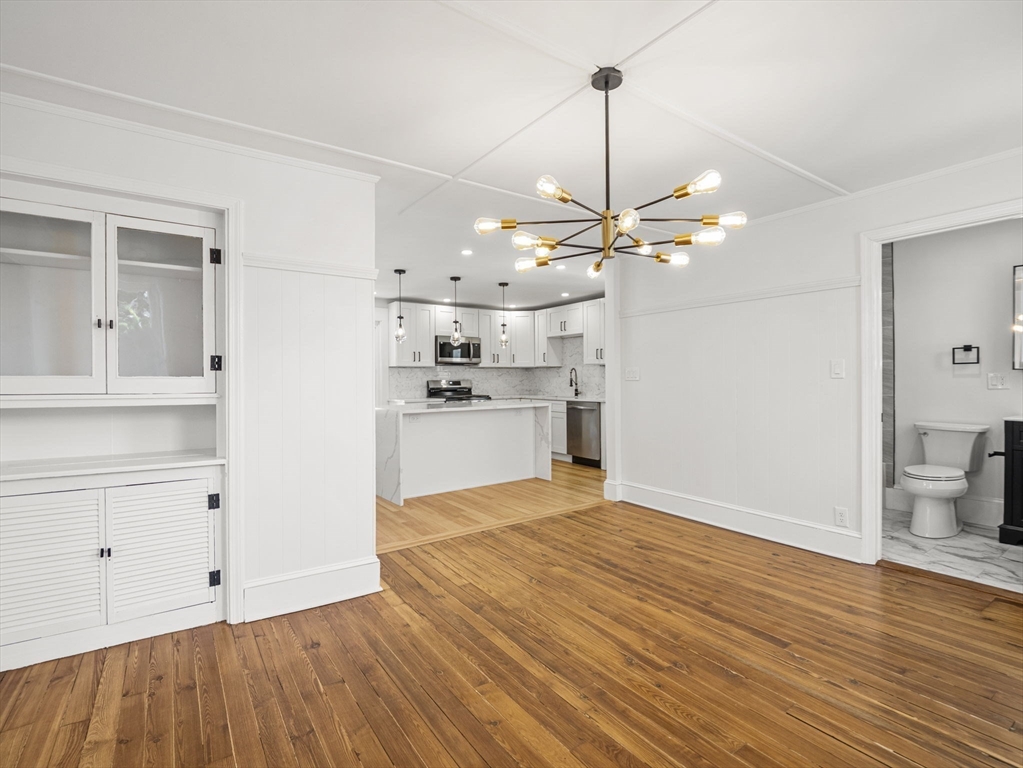 224 Pelham Street Methuen, MA 01844 - Photo 15 of 40 a view of a kitchen with microwave and a ceiling fan