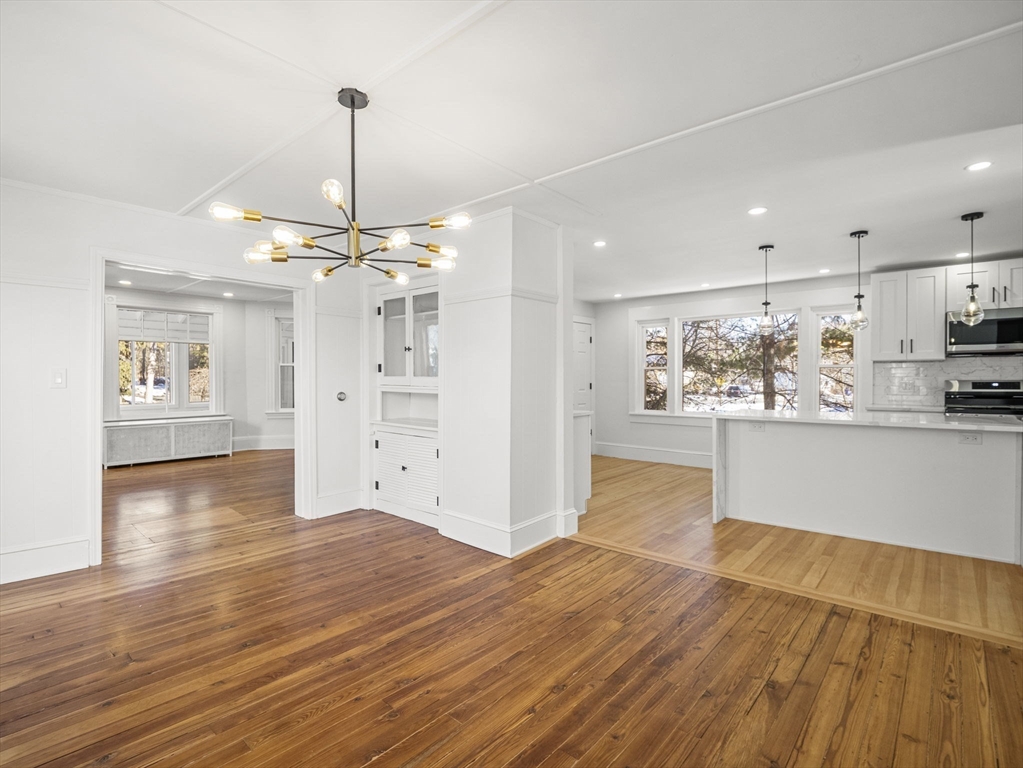 224 Pelham Street Methuen, MA 01844 - Photo 16 of 40 a view of a kitchen with wooden floor and windows