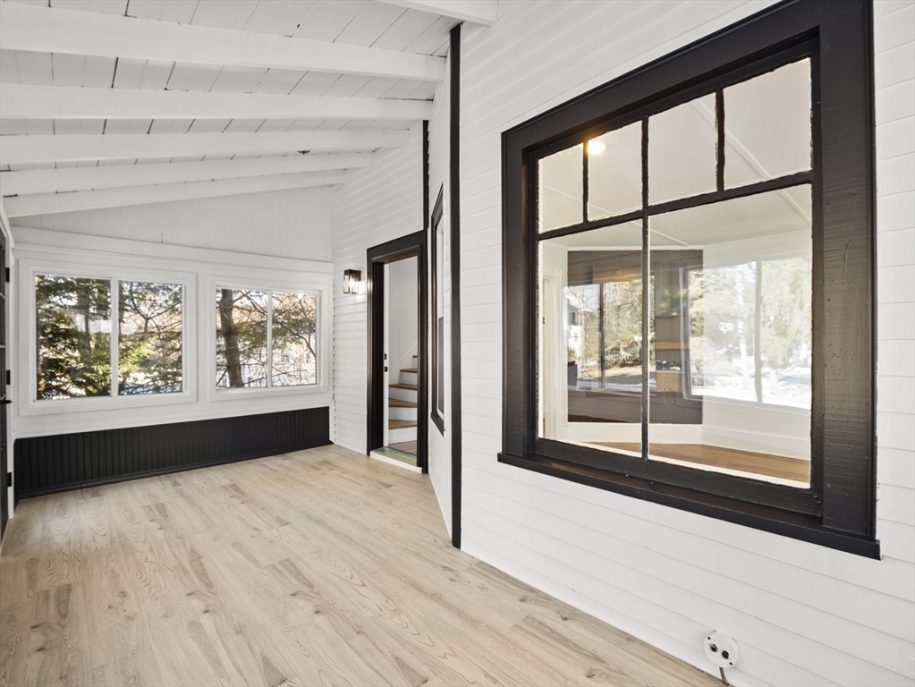 224 Pelham Street Methuen, MA 01844 - Photo 20 of 40 a view of an empty room with a window and hardwood floor