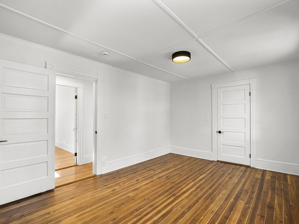 224 Pelham Street Methuen, MA 01844 - Photo 22 of 40 a view of empty room with wooden floor