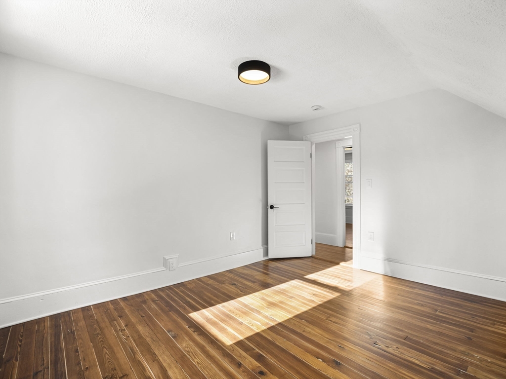 224 Pelham Street Methuen, MA 01844 - Photo 27 of 40 a view of an empty room and wooden floor