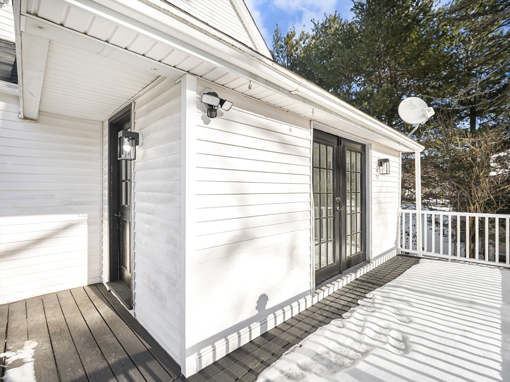 224 Pelham Street Methuen, MA 01844 - Photo 38 of 40 a view of a balcony with wooden floor and fence