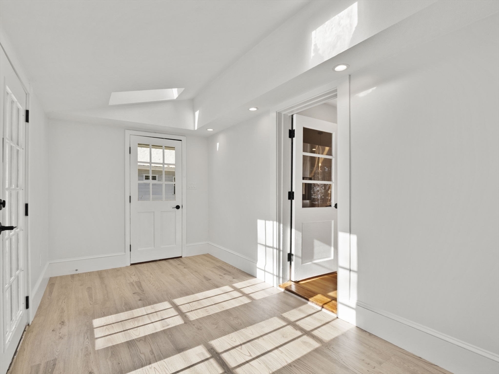 224 Pelham Street Methuen, MA 01844 - Photo 5 of 40 a bedroom with a bed and the view of living room