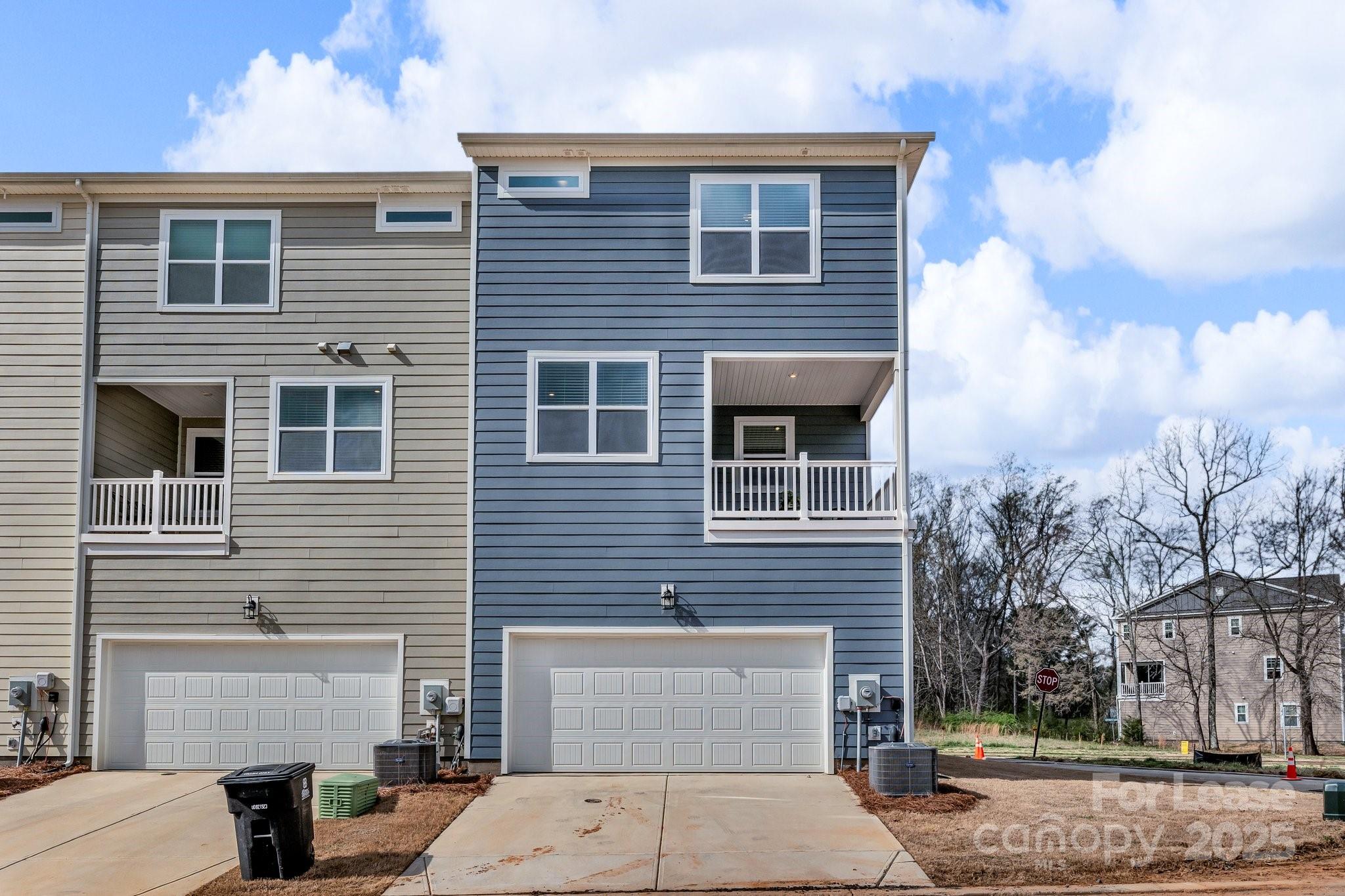 16764 Summers Walk Boulevard Davidson, NC 28036 - Photo 2 of 26 a front view of a house with garage