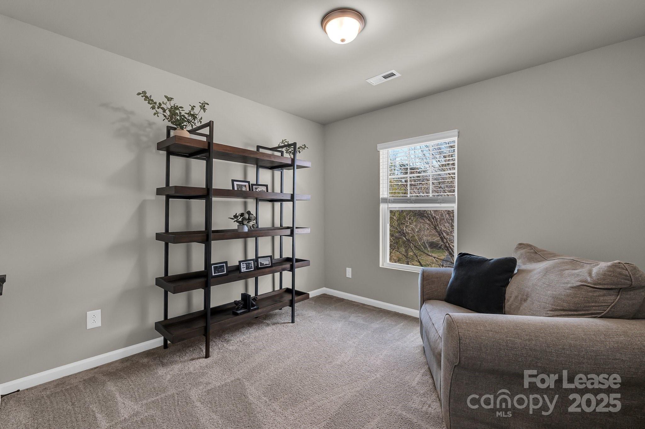 16764 Summers Walk Boulevard Davidson, NC 28036 - Photo 25 of 26 a living room with furniture and window