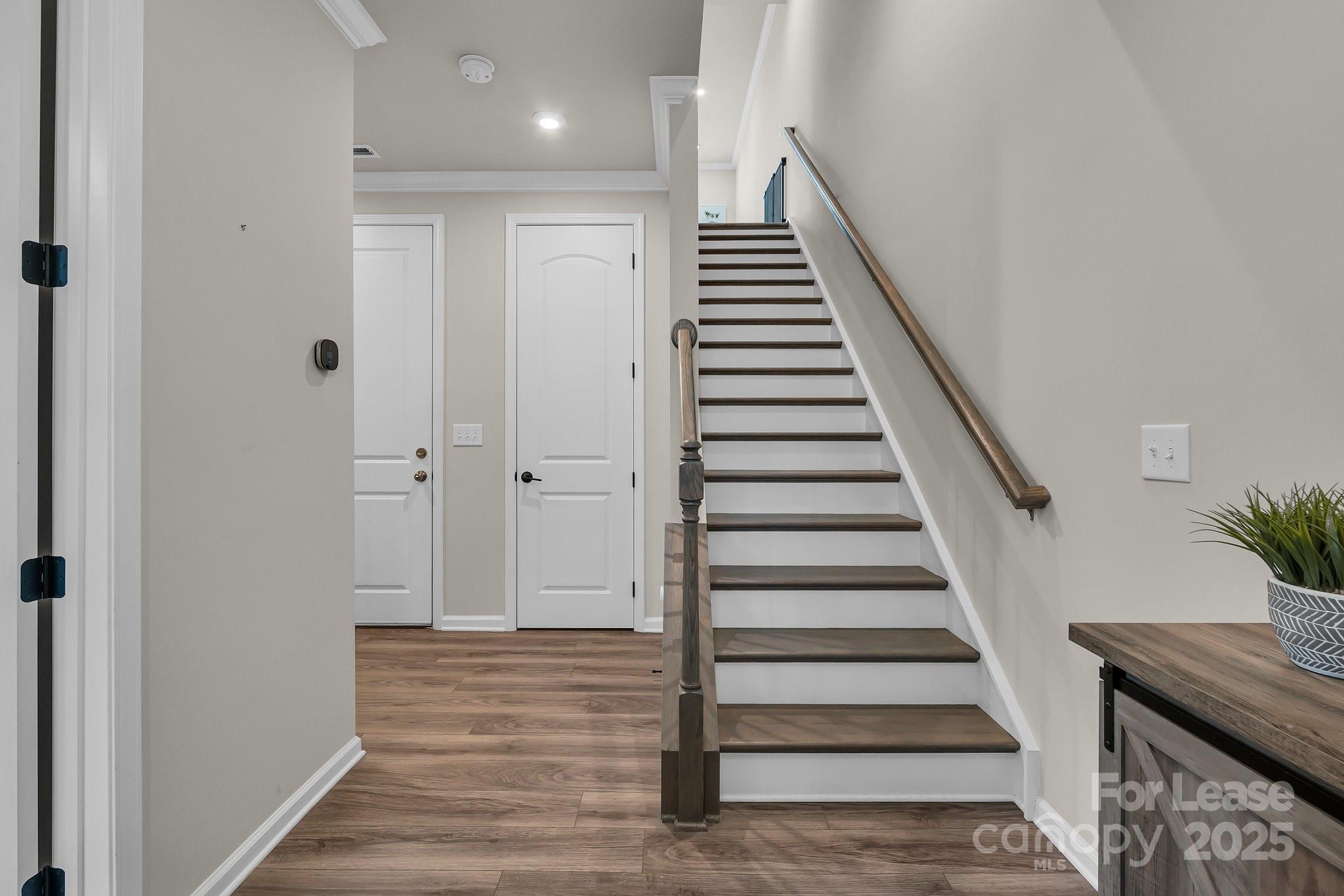 16764 Summers Walk Boulevard Davidson, NC 28036 - Photo 6 of 26 a view of a hallway with wooden floor and entryway