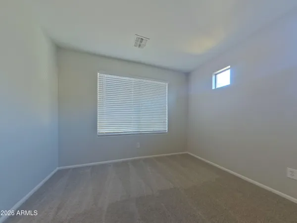 a white toilet and tub next to a shower