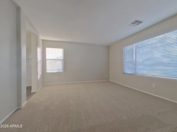 a kitchen with stainless steel appliances granite countertop a stove a sink dishwasher and a microwave oven with wooden cabinets