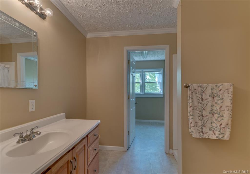 246 Clark Road Rutherfordton, NC 28139 - Photo 14 of 24 a bathroom with a sink and a mirror