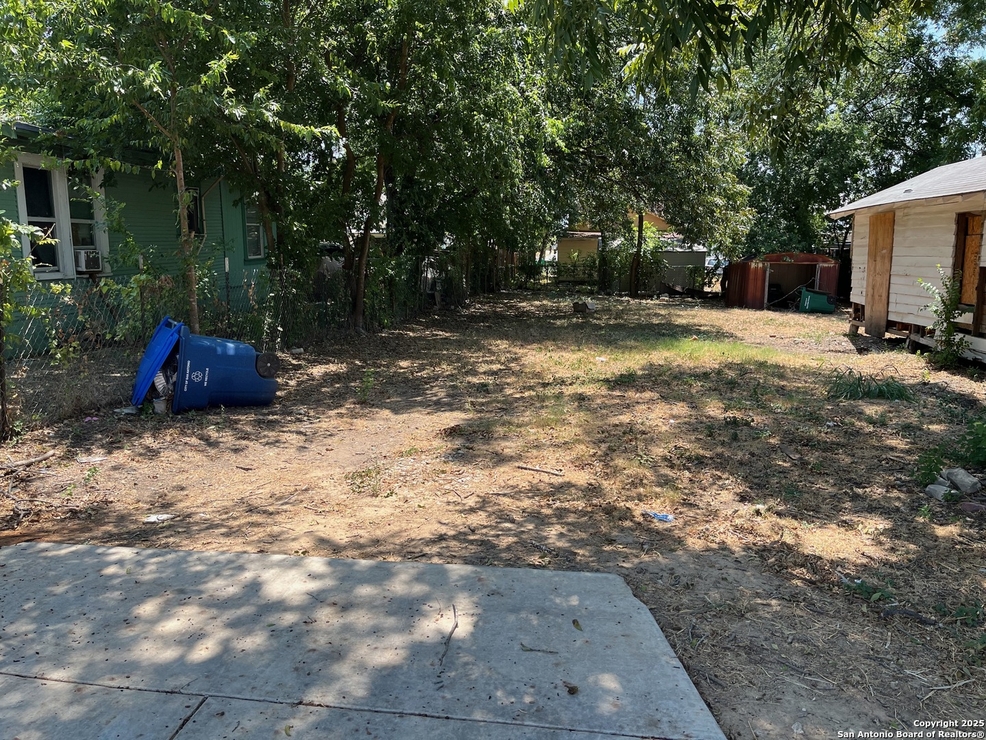 136 Alabama Street San Antonio, TX 78203 - Photo 2 of 5 a view of a backyard with trees