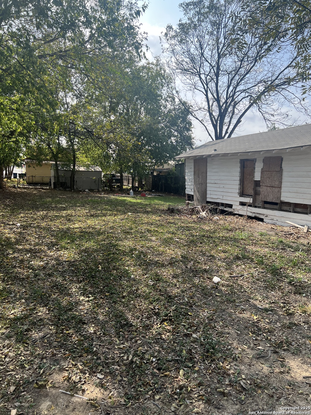 136 Alabama Street San Antonio, TX 78203 - Photo 5 of 5 a backyard of a house with yard and trees
