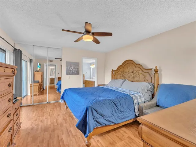 a bedroom with two beds and painting on the wall