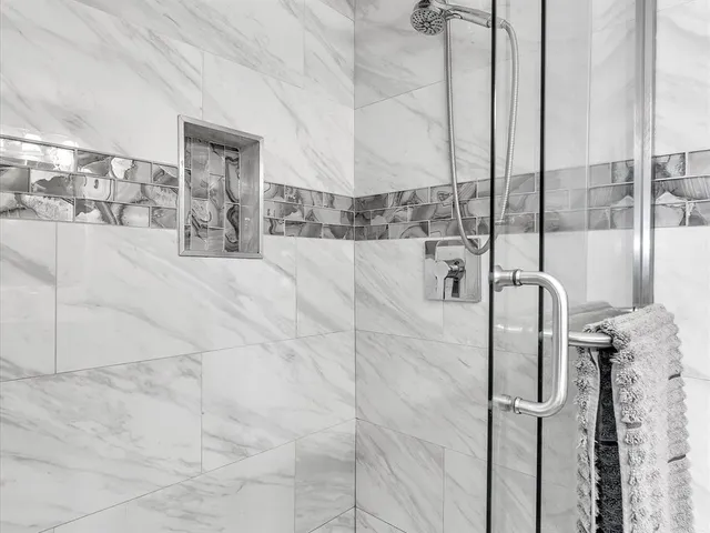 a bedroom with bed and flat screen tv