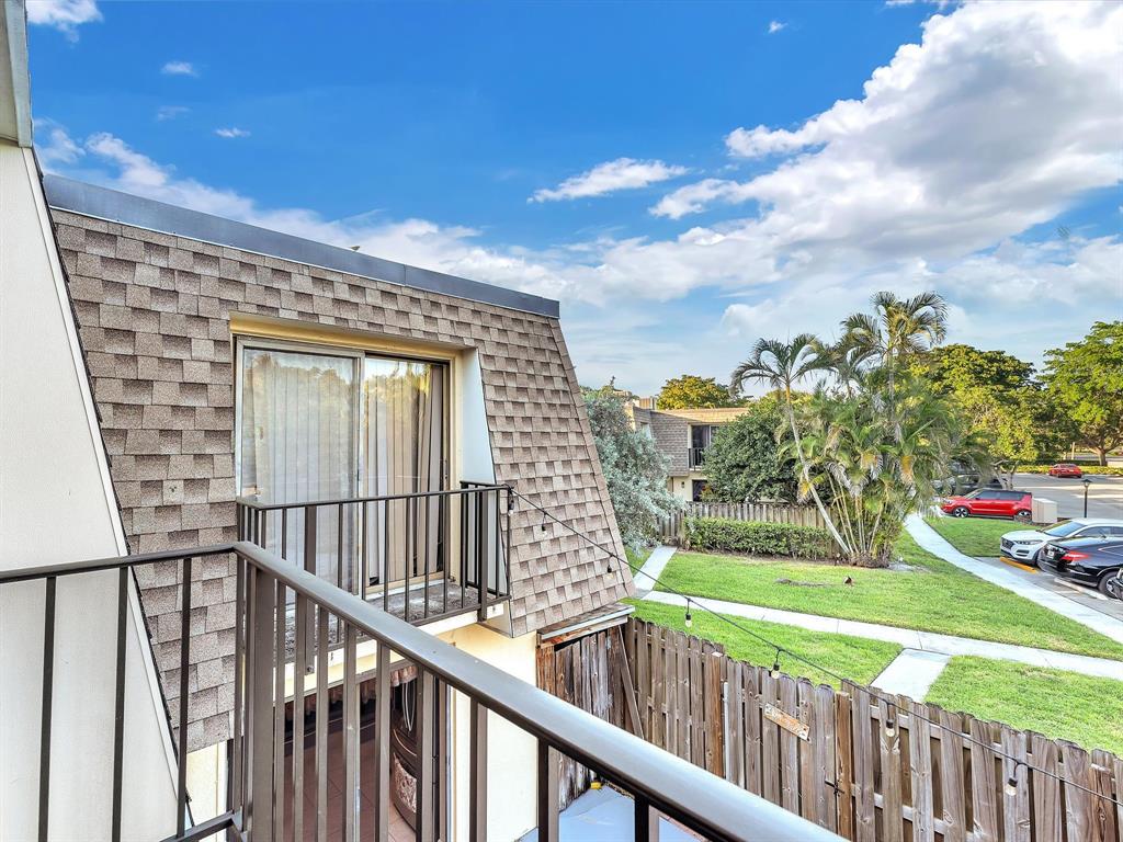 2947 Southwest 22nd Circle, Unit 28D Delray Beach, FL 33445 - Photo 19 of 32 a view of a porch with a yard