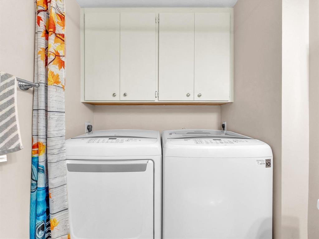 2947 Southwest 22nd Circle, Unit 28D Delray Beach, FL 33445 - Photo 22 of 32 a utility room with dryer and washer