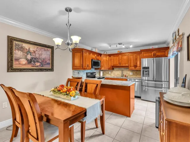 a dining room dining table chairs and kitchen view