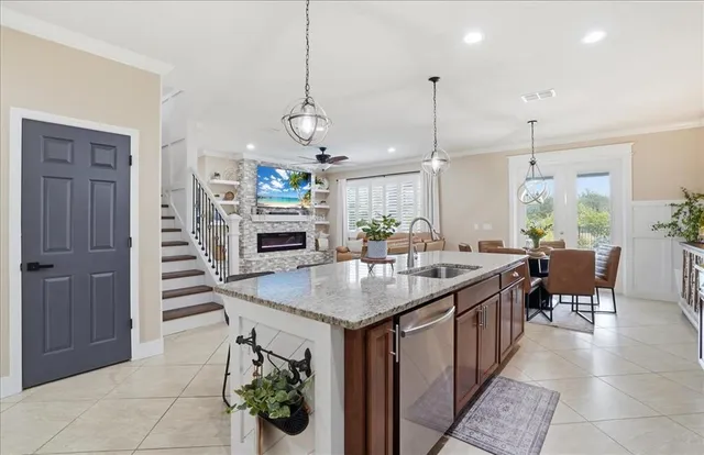 a kitchen with granite countertop a counter space appliances and cabinets