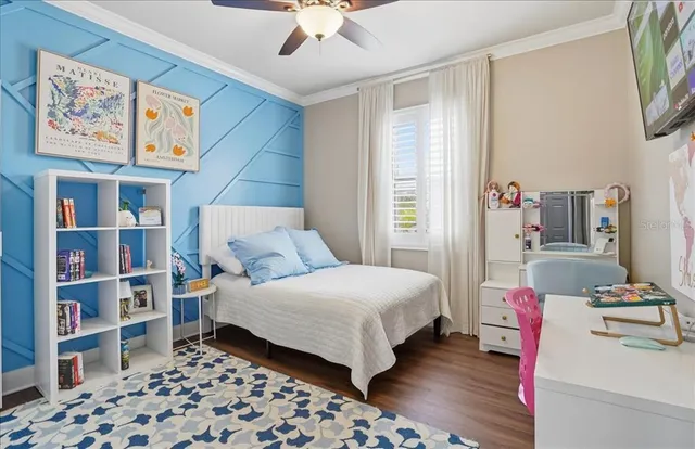 a bathroom with a granite countertop sink a toilet a mirror and shower