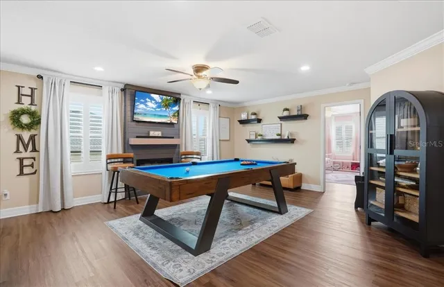 a living room with furniture a rug and a chandelier