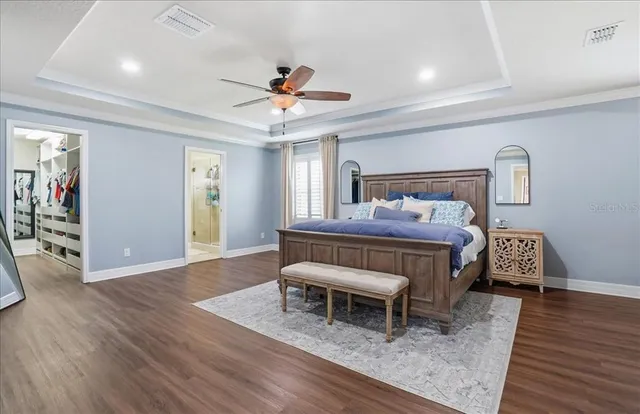 a bedroom with a bed dresser and a window