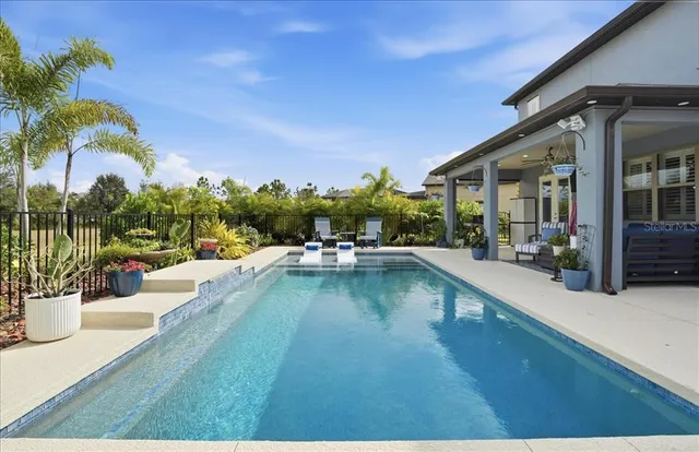 a living room with fireplace furniture and a wooden floor