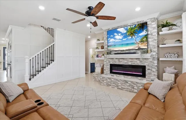 a living room with furniture and kitchen view