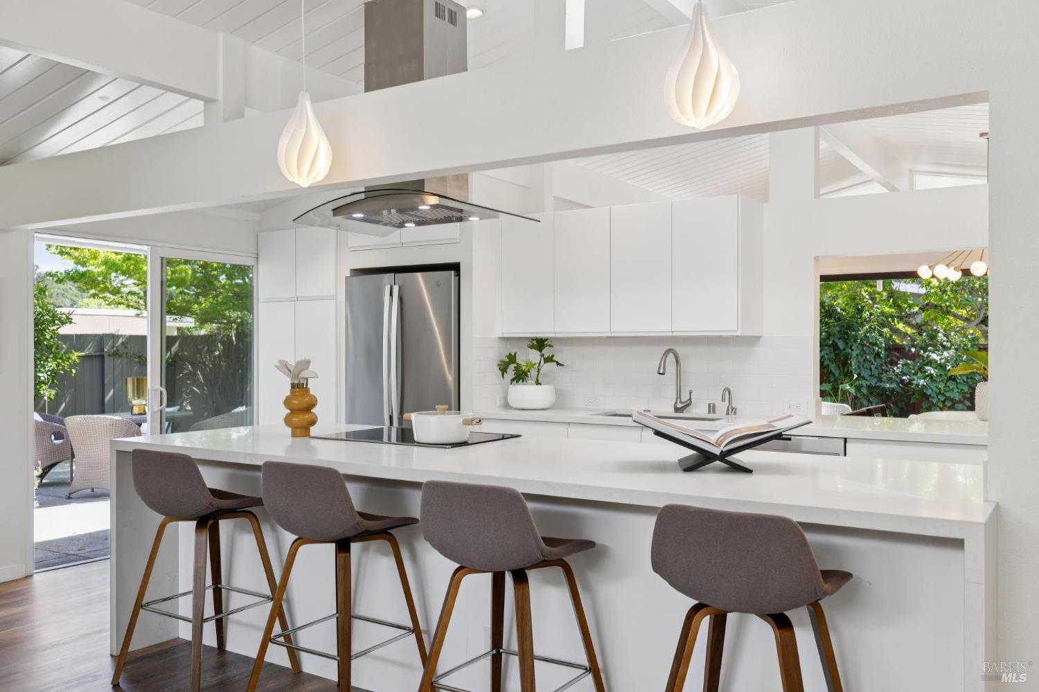 839 Greenberry Lane San Rafael, CA 94903 - Photo 14 of 57 a kitchen with a table chairs stove and cabinets