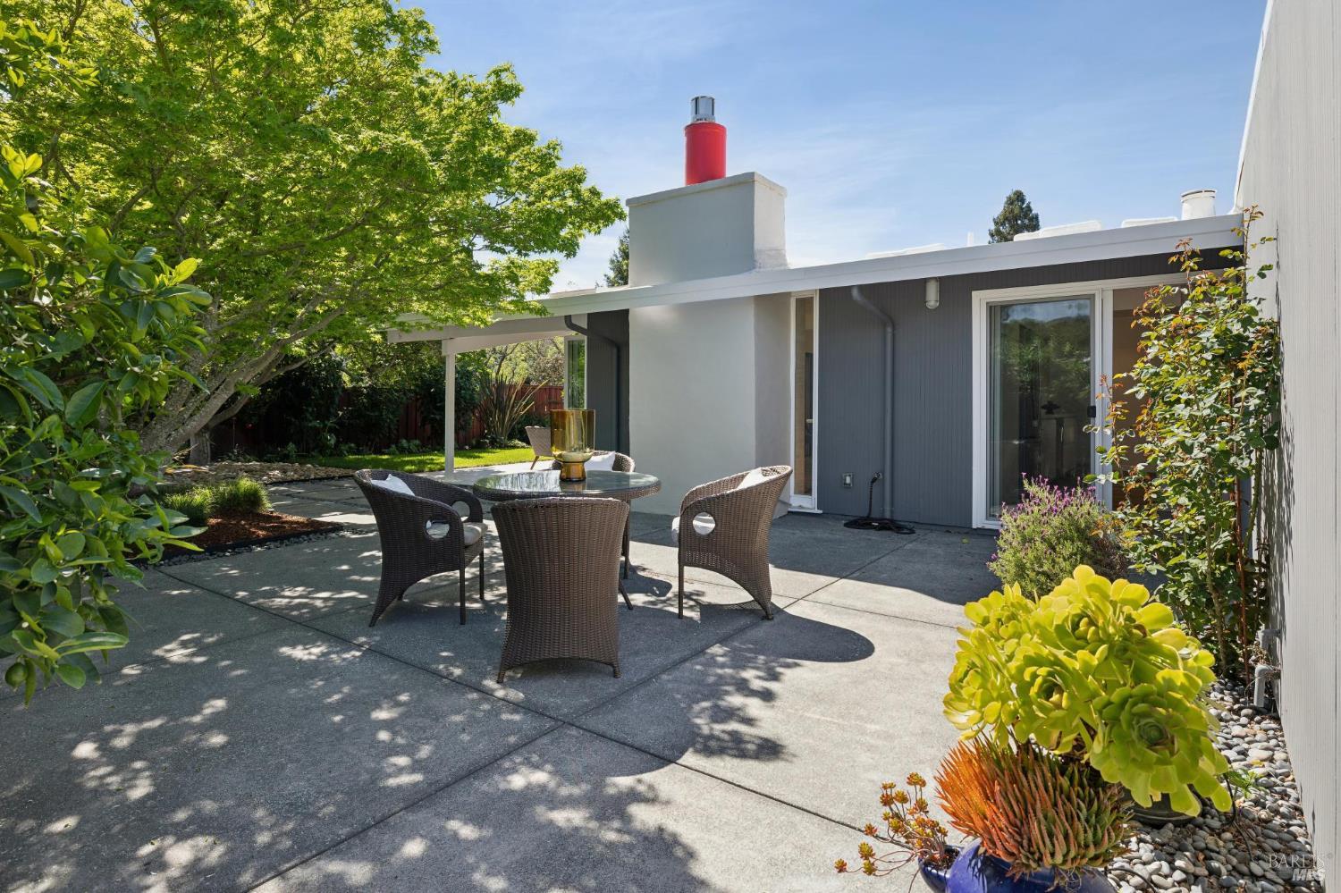 839 Greenberry Lane San Rafael, CA 94903 - Photo 18 of 57 a view of a patio with table and chairs and potted plants