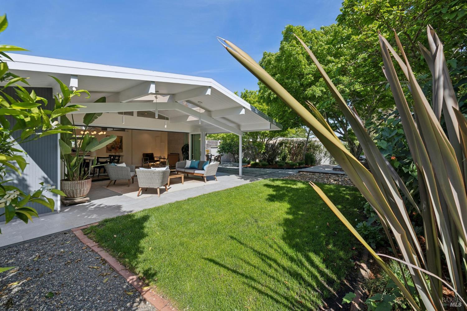839 Greenberry Lane San Rafael, CA 94903 - Photo 25 of 57 a view of a patio with table and chairs potted plants with wooden floor