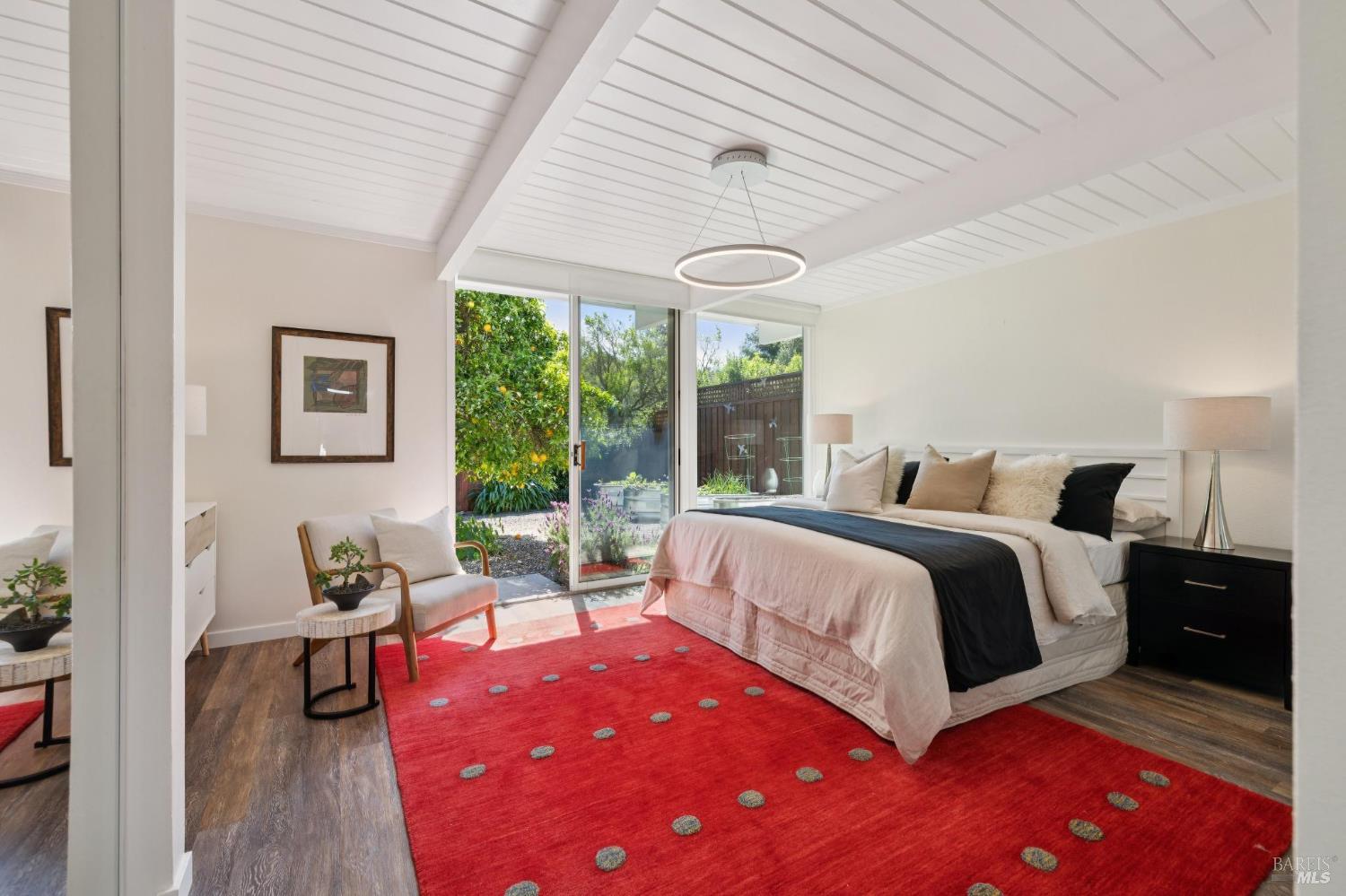 839 Greenberry Lane San Rafael, CA 94903 - Photo 28 of 57 a bedroom with a bed and wooden floor