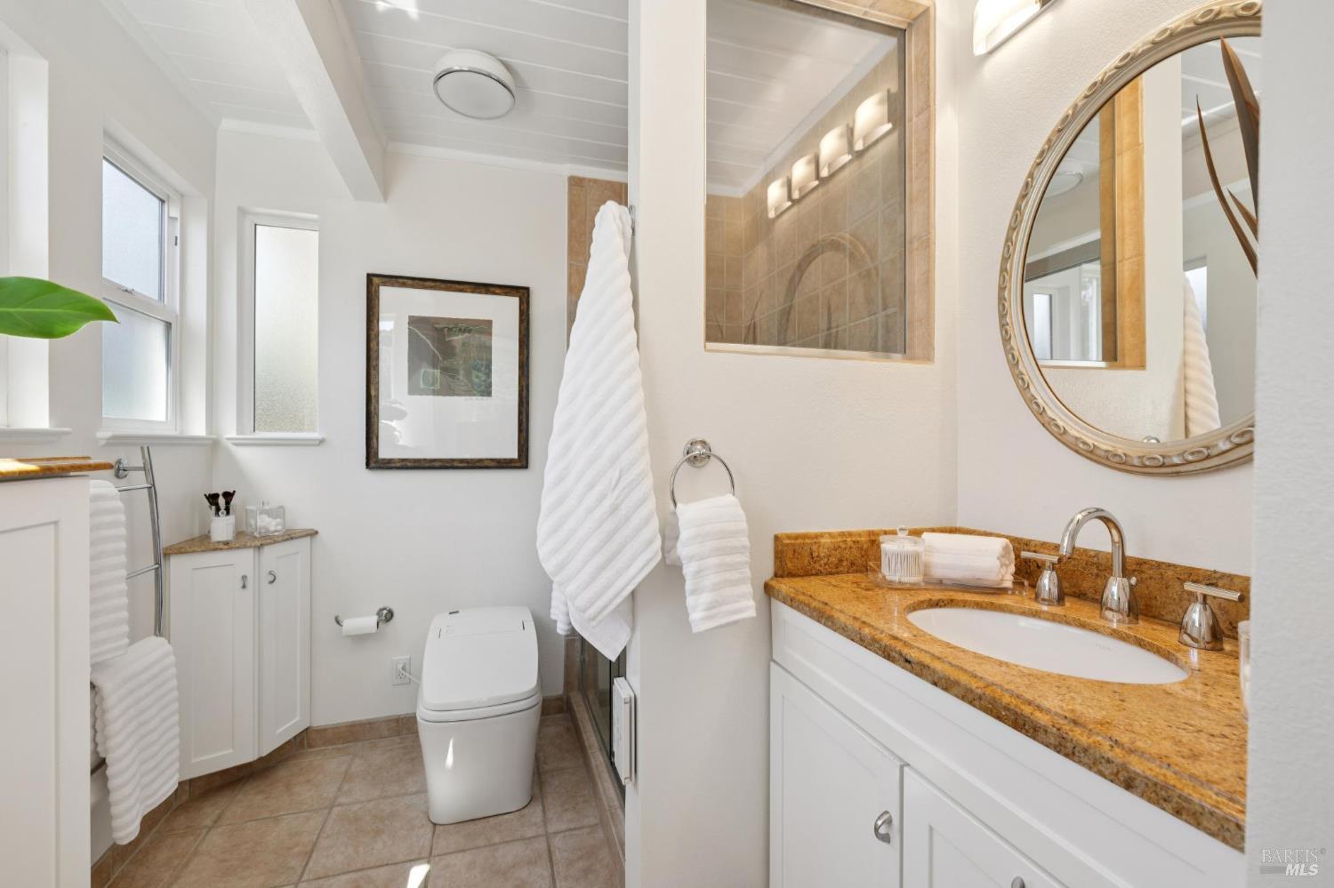 839 Greenberry Lane San Rafael, CA 94903 - Photo 34 of 57 a bathroom with a granite countertop toilet sink and mirror