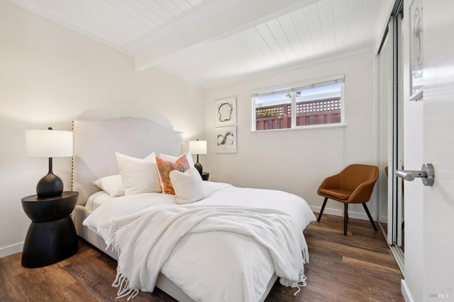 839 Greenberry Lane San Rafael, CA 94903 - Photo 37 of 57 a bedroom with a bed and a chair