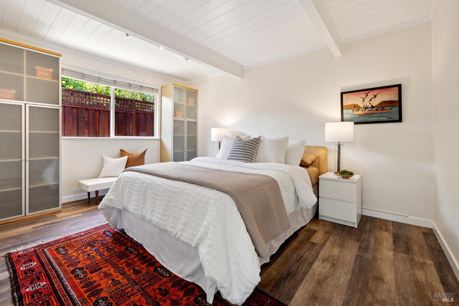 839 Greenberry Lane San Rafael, CA 94903 - Photo 40 of 57 a bedroom with a bed and wooden floor