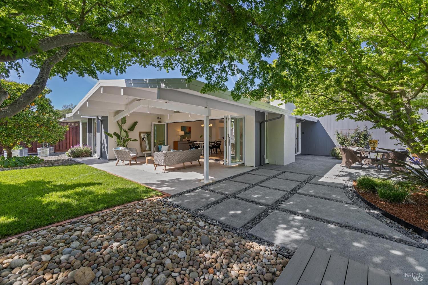 839 Greenberry Lane San Rafael, CA 94903 - Photo 48 of 57 a view of a patio with table and chairs under an umbrella