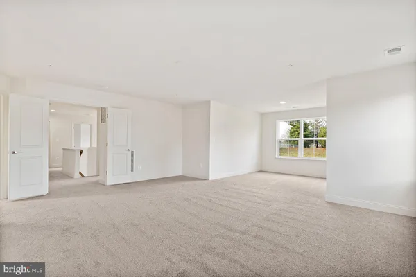 a view of empty room with windows