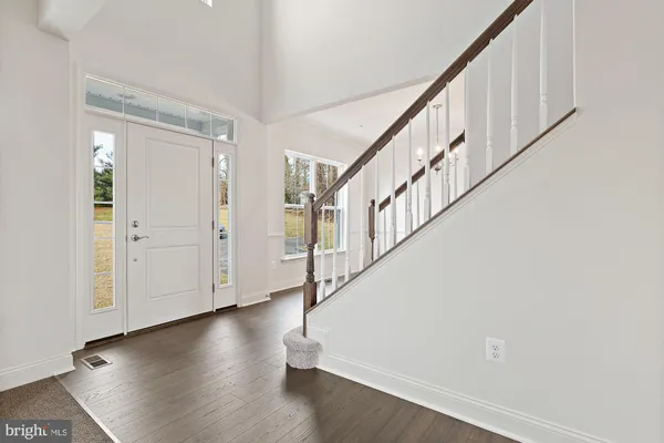 a view of entryway with wooden floor