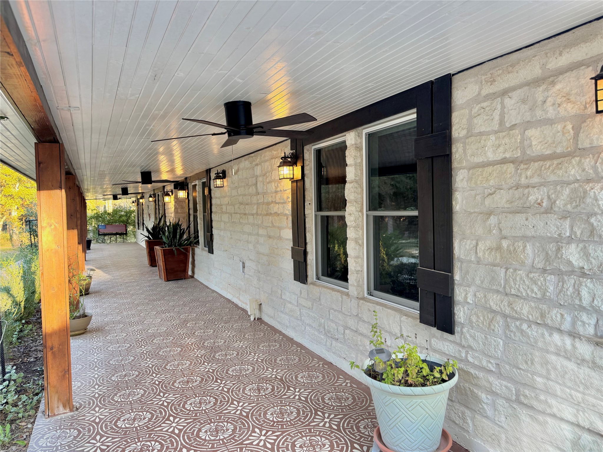 30309 Live Oak Trail Georgetown, TX 78633 - Photo 14 of 40 Addition of a beautiful front porch with new fans, porch swing and dusk to dawn lighting.
