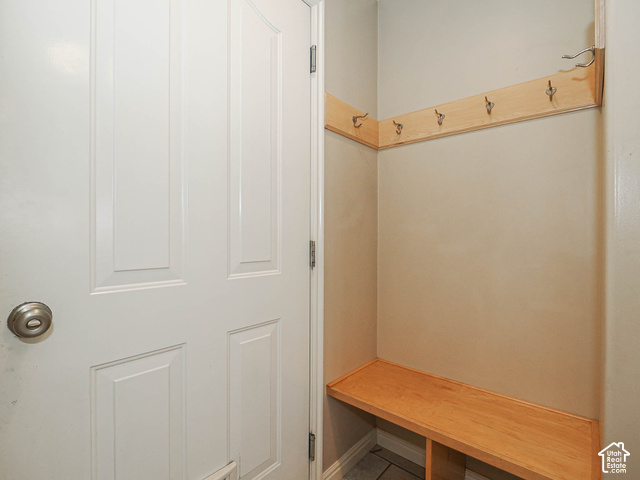 11779 South Stone Ridge Court Ridge West Riverton, UT 84065 - Photo 47 of 85 Recessed entryway bench with a wood finish, complemented by a coat rack featuring multiple hooks