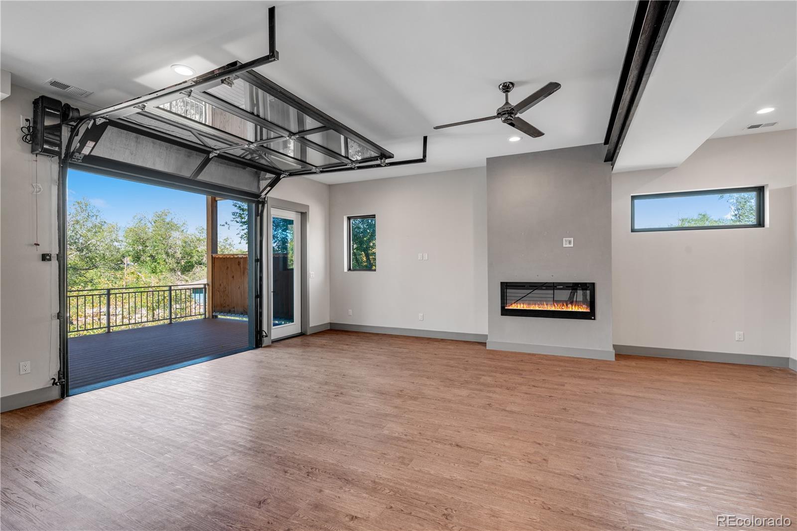 2260 Glenn Street Colorado Springs, CO 80904 - Photo 15 of 45 a view of a livingroom with wooden floor and windows