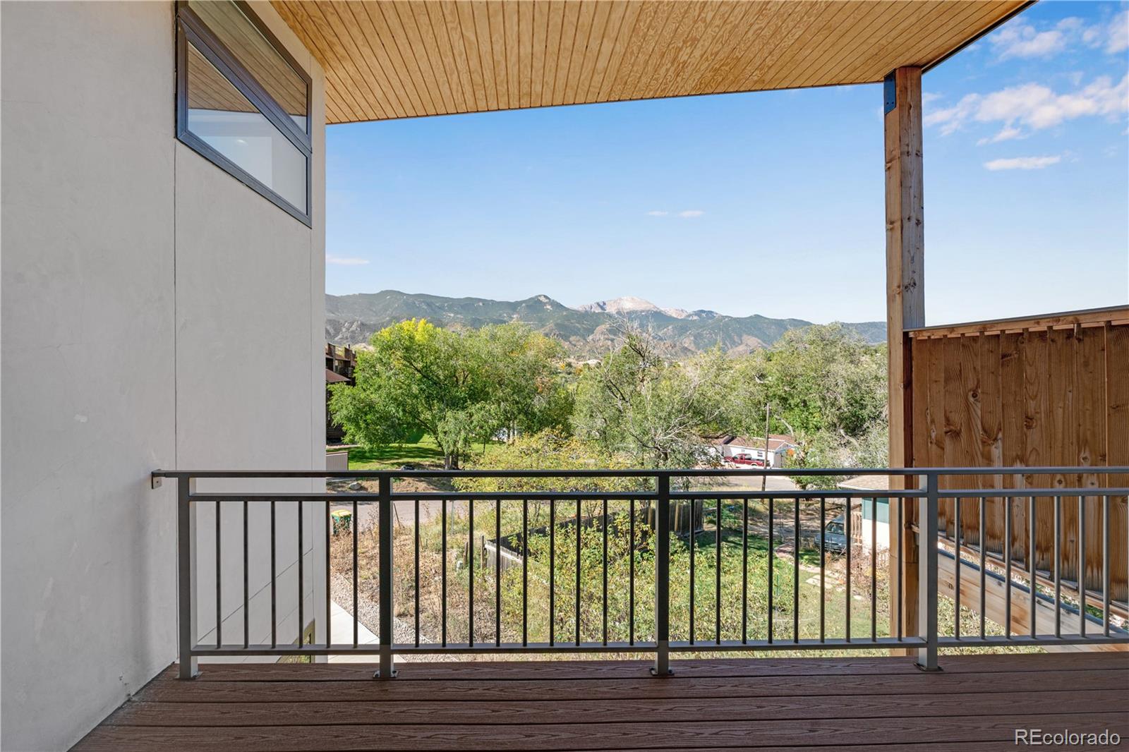 2260 Glenn Street Colorado Springs, CO 80904 - Photo 20 of 45 a view of balcony with wooden floor and fence